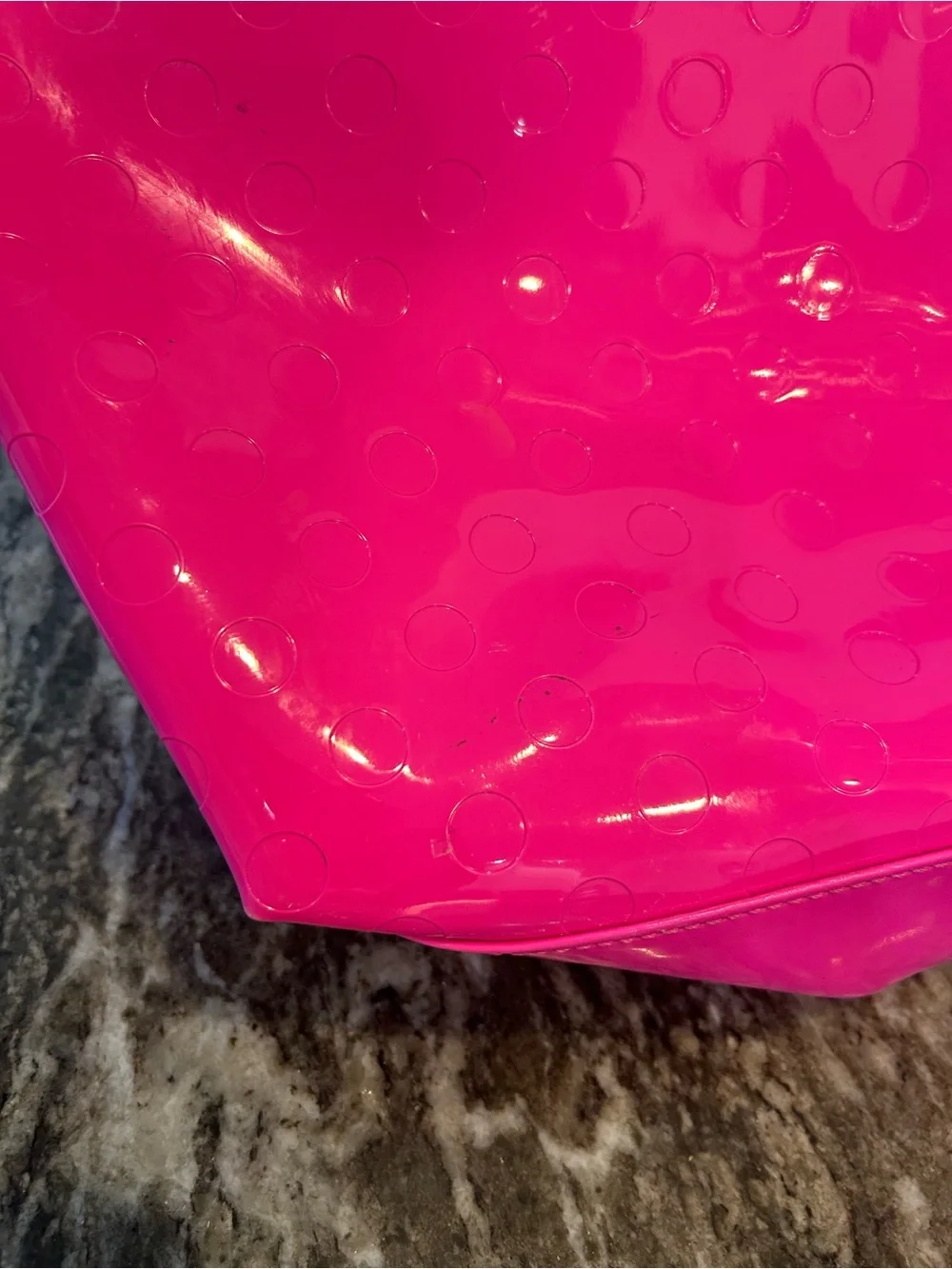 kate spade camellia st Sophie Tote in Hot Pink has a few marks scuffs peeling